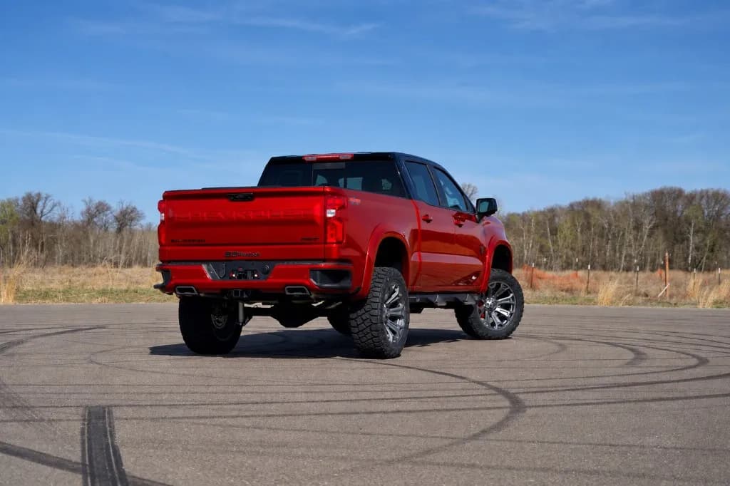 Rear three-quarter view of the Radiant Red custom Chevy Silverado